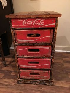 an old coca - cola chest with three drawers