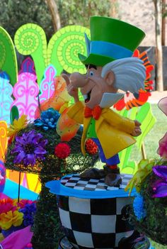 an image of a garden decoration in the shape of a man on top of a flower pot