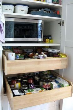 an open refrigerator door with shelves full of food and containers on it's sides