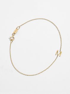 Take the simple chain bracelet one stylish step further with this 14K gold design, which features a chic initial accent. Try layering the look for true statement style. Classic 14k Gold Diamond Bracelet With Adjustable Chain, Classic Gold Name Bracelet With Chain, Minimalist Gold Diamond Bracelet In Sterling Silver, Minimalist Yellow Gold Name Bracelet With Adjustable Chain, Dainty 14k Yellow Gold Name Bracelet, Classic 14k Gold Name Bracelet For Everyday, Minimalist Yellow Gold Name Bracelet For Formal Occasions, Modern 14k Gold Name Bracelet For Formal Occasions, Luxury 14k Gold Name Bracelet With Initials