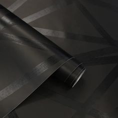 a black and silver wallpaper with an abstract design on it's surface is shown