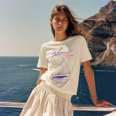 Introducing our vintage-style, distressed mediterranean line of tees, a perfect blend of timeless style and coastal charm. Featuring distressed printing for a quaint, retro feel, this shirt evokes the relaxed and sun-kissed spirit of the Mediterranean. Ideal for those who appreciate a classic look with a touch of nostalgia, it's perfect for casual outings and seaside strolls. Embrace the essence of coastal living with this effortlessly stylish piece. Made from very soft materials, this tee is 100% cotton. The shoulders have twill tape for improved durability. There are no side seams. The collar is made with ribbed knitting to prevent curling damage.  *Made with 100% ring-spun cotton, a lightweight fabric (4.5 oz/yd² (153 g/m this unisex t-shirt feels like a bliss to wear all year round.  * Relaxed Fit Crew T-shirt For Summer, Nautical Short Sleeve Beach Top, White Nautical Short Sleeve Tops, White Nautical Crew Neck Top, White Nautical Tops For Vacation, Cotton Nautical Tops For Vacation, Nautical Style Cotton Tops For Vacation, Nautical Cotton Tops For Vacation, Casual Cotton T-shirt For Sailing