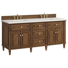 a double sink vanity with two faucets and marble counter top in dark wood