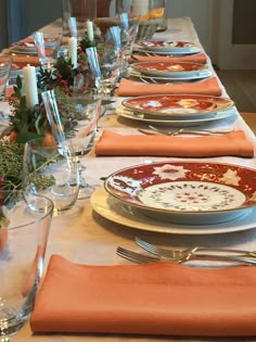 an image of a table setting with plates and silverware on it for formal dinner