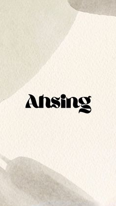 an abstract photo with the word asking written in black on top of white and gray paper