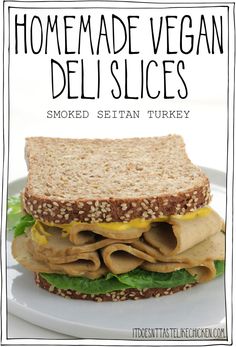 a close up of a sandwich on a plate with the words homemade vegan deli slices