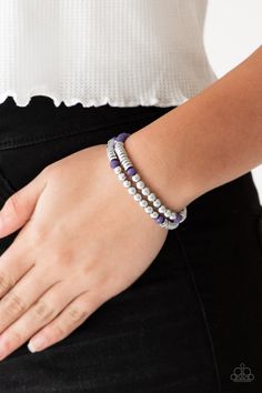 Classic silver beads, faceted purple beads, and dainty silver discs are threaded along stretchy bands, creating shimmery layers across the wrist.

Sold as one set of two bracelets. Purple Beads, Rose Gold Beads, Purple Bracelet, Silver Frames, Paparazzi Accessories, Blue Gems, Paparazzi Jewelry, One Set, Silver Accents