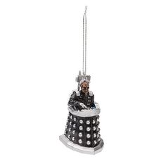 a christmas ornament with a doctor who is sitting on it's side