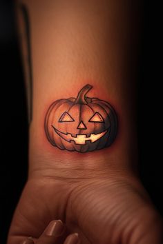 a person with a tattoo on their ankle that has a jack - o'- lantern in it