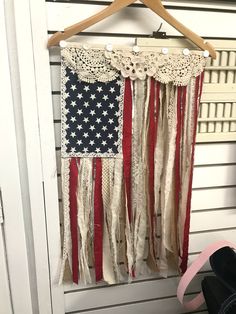 an american flag hanging on a wall