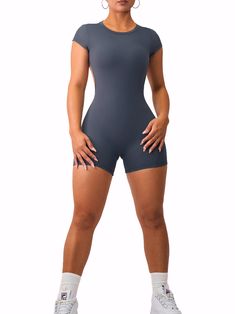 Description: NOW PADDED! This elegant romper is a must-have gym outfit! Its flattering design features an open back that will turn heads while keeping you secure and comfortable. All of our rompers & jumpsuits are made out of high quality blends of nylon and are guaranteed to shape your figure while providing high comfort and sweat resistance. Sizing: We recommend sizing up if you are 5'4 or taller. Color: Charcoal Fabric: Premier Buttersoft Seamless