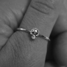 This skull ring is dainty and perfect for the grunge minimalist, made of 925 sterling silver small skull on a delicate band.  It goes well stacked with other bands, but is also stunning on its own. Custom made in half sizes between sizes 0-13. To ensure you are happy with your ring, please make sure you have confirmed your ring size in US sizes! I can help if you are having trouble. If shopping for a gift for a loved one, you can select gift wrap at check out and I will make sure it's wrapped up with love! Silver Adjustable Symbolic Skull Ring, Handmade Symbolic Silver Skull Ring, Silver Punk Skull Ring, Silver Skull Rings Hallmarked, Handmade Silver Skull Ring, Symbolic Style, Goth Ring, Small Skull, Skull Ring, Halloween Skeletons