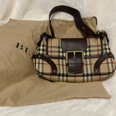 This Classic Burberry Satchel Is Stunning. It Has Been Gently Used. It Comes With Dust Bag. For All The Burberry Lovers This Satchel Is Made In Italy . Poshmark Guarantees Authenticity Offers Welcome Burberry Handbags Classic, Burberry Messenger Bag, Vintage Burberry Bag, Burberry Camberley Bag, Vintage Burberry Bag Lyst, Burberry Shoulder Bag Mytheresa.com, Burberry Bag, Burberry, Dust Bag