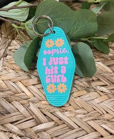 a keychain that says, i hope i just hit a curb on it