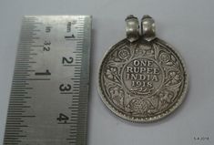 "VINTAGE ANTIQUE COLLECTIBLE TRIBAL OLD SILVER GEORGE 5 KING EMPEROR COIN PENDANT NECKLACE (ONE RUPPE INDIA 1918), FROM BRITISH INDIA, GREAT DESIGN, GOOD FOR JEWELLERY COLLECTION. Weight - 14 grams Height - 3.8 cm(1.5\") Width - 2.9 cm(1.14) Material - Good silver & original old worn piece." Vintage Oxidized Coin Necklace, Silver Coin Pendant Necklace For Festivals, Antique Silver Coin Necklace, British India, Coin Pendant Necklace, Coin Pendant, Jewellery Collection, Silver Pendant, Vintage Antiques