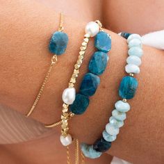 Our Apatite Gemstone Bracelet features beautiful blue gemstones on a dainty gold bracelet that is adjustable, making it the perfect fit for any wrist size. Show off your style with this stunning bracelet and enjoy the compliments you are sure to receive! Dainty Stone Bracelet, Blue Stackable Bracelets, Stones Bracelets Ideas, Natural Stone Beaded Bracelets, Natural Stone Bracelet Ideas, Gemstone Bracelets Ideas, Pull Bracelet, Sea Beads, Blue Stone Bracelet