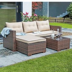 an outdoor patio furniture set on the grass