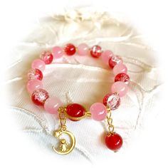 Beautiful blends pink and red cracked marbled beads with little cute gold colored rabbit charm. 100% hand made and good gift for friends or family. Rabbit Charm, Pink And Red, Bead Bracelet, Best Friend Gifts, For Friends, Gold Color, Jewelry Bracelets, Best Gifts, Accessory Gift