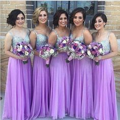 the bridesmaids are all wearing purple dresses