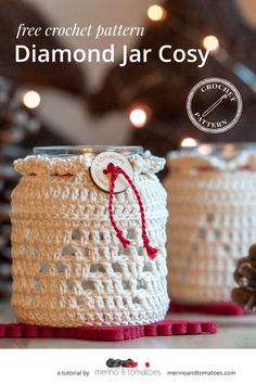 two crocheted jars are sitting on the table with christmas lights in the background