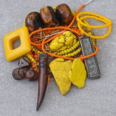 China Sunset Bead Collection: chunky yellow magnesite and slab stones vintage 4 Buddha worn pendant 50mm Kenyan batik brown bone Kenyan batik brown horn pendant 66mm unique yellow resin square frame from Indonesia yellow African glass trade beads orange African glass tiny trade beads yellow Czech glass faceted rondelles orange bone rondelles Tibetan dZi agate beads tiny African brass beads China Sunset, Resin Square, Yellow Resin, Bead Collection, Making People Happy, Horn Pendant, Brass Beads, Buddha Pendant, Trade Beads