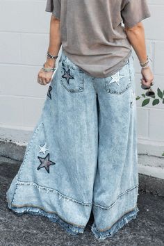 You're A Star Pants in Denim Blue ♡ Product Highlights ♡ Our You're A Star Pants in Denim Blue are the perfect staple and statement bottoms to add to your closet, and or any on-trend bohemian style outfit! Accompanying a trendy and stylish star patch detail, lightly frayed & distressed ends, and a 4 pocket styling, for all of your personal go-to items, these pants will be sure to be one of your faves! ✁ Contents & Measurements ✁ These You're A Star Pants in Denim Blue are constructed with 100% T Bohemian Medium Wash Denim Pants, Denim Blue Bohemian Relaxed Fit Pants, Bohemian Style Relaxed Fit Denim Blue Pants, Summer Star Print Straight Leg Pants, Summer Straight Leg Pants With Star Print, Dark Wash Stonewashed Bottoms For Spring, Bohemian Summer Jeans With Frayed Hem, Bohemian Style Denim Blue Cotton Pants, Bohemian Denim Blue Cotton Pants