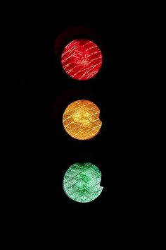 a traffic light that is red, green and yellow