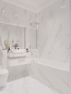 a bathroom with white marble walls and flooring, including a bathtub next to a toilet