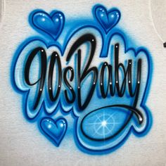 a white shirt with the word oh baby painted on it's chest and blue hearts