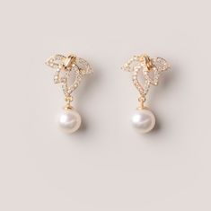 Stud earrings made with 14k gold fill and freshwater pearls. - Each pair is specially made to order. There might be tiny differences between each set due differences in pearls. Length: 25mm Gold Delicate Hypoallergenic Pearl Earrings, Elegant Yellow Gold Pearl Earrings With Charm, Dainty Gold Akoya Pearl Earrings, Gold Akoya Pearl Hypoallergenic Earrings, Elegant Shell-shaped Pearl Earrings, Summer Gold Shell-shaped Pearl Earrings, Gold Pearl Shell-shaped Earrings, 14k Gold-filled Yellow Gold Pearl Earrings With Charm, Simple Pearl