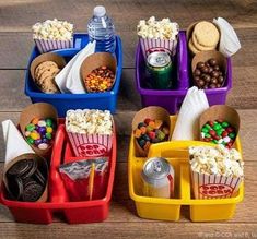 three plastic containers filled with food on top of a wooden floor next to each other