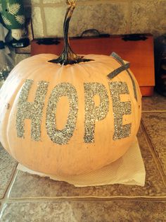 a pumpkin with the word hope painted on it