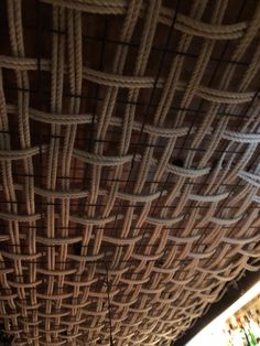 the ceiling is made up of rope and wood