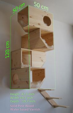 the bird house is made from wood and has three levels to fit in with each other