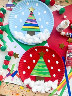 paper plates with christmas trees and decorations on them