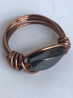 Handmade copper wire wrapped ring for women or a man.  Magnetic ring for anxiety relief. I hand wrapped this unique hematite ring with antique copper tarnish resistant wire.  The hematite stone is a polished rectangular shape with a swirl. Metallic and magnetic. Hematite helps to absorb negative energy and comes in times of stress or worry. Hematite is a very protective stone and is great to wear to help you stay grounded in many situations. Hematite is also good for working with the root chakra Crystal Protection, Ring With Stone, Wire Wrap Ring, Ring For Man, Sodalite Necklace, Hematite Ring, Protection Ring, Ring Wire, Crystal Choker Necklace