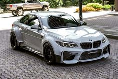 a silver car parked on the side of a street