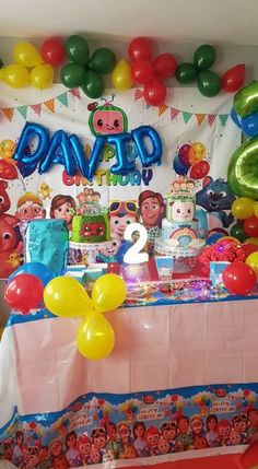 a birthday party with balloons and decorations