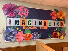 a bulletin board with paper flowers and words that say i'm magnification blooms here