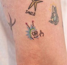 a person with tattoos on their legs that say smile and the other has a star