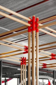 several red poles are attached to the ceiling