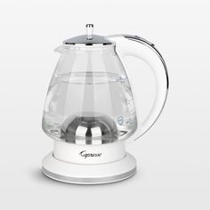 an electric kettle with a glass lid and handle on the top is shown in front of a white background