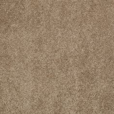 a close up view of a tan colored carpet