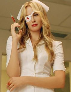 a woman in white uniform holding a knife and eye patch with the caption kill bill on it