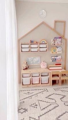 a child's playroom with toys and storage bins