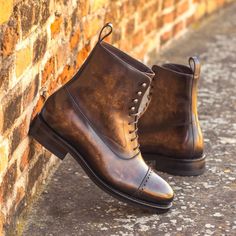 The Balmoral Boot is the epitome of a sophisticated and formal footwear. Drawing inspiration from vintage European styles, it showcases closed channel lacing as well as speed hook lacing, to form a sleek silhouette, often with a contrasting upper panel. These boots embody the essence of class and elegance, reminiscent of the best of European shoemaking heritage. Maison Kingsley Couture Spain brings a new level of craftsmanship to the Balmoral boot with bespoke, hand-made creations. Using only the finest Italian materials and sartorial fabrics, each boot is hand-painted with natural oils and dyes to produce a unique and luxurious finish. The... Balmoral Boots, Patina Style, Botas Chelsea, Vintage European, Shoe Tree, Jodhpur, Goodyear Welt, Mens Navy, Handmade Shoes