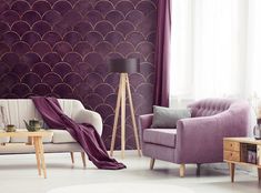 a living room filled with furniture and a large purple wallpaper behind the couches