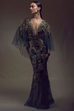 Marchesa mesh v-neck gown in peacock. 92% Silk, 8% Elastic, Lining: 100% Nylon Dry Clean Only Made in USA Luxury V-neck Evening Gown, Luxury V-neck Gown, Luxury V-neck Gown For Gala, Luxury V-neck Gala Gown, Luxury Spring V-neck Evening Dress, Luxury Evening Gown With V-neck, Luxury Evening V-neck Gown, Luxury V-neck Cocktail Gown, Evening Tulle Gown With V-neck