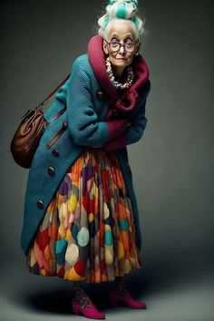 an older woman with blue hair and glasses wearing a multicolored dress, coat and shoes