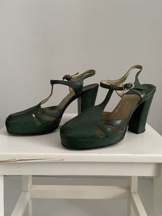 Vintage 1940s green leather platforms , ankle strap and sturdy heel. Fits like: us 6-6.5 | euro 36-37 | uk 3.5-4 Insole: 9.5" Ball: 3" Heel: 4" with a 1" ball platform Brand/maker:  Condition: excellent ( see photo ) ➸ more vintage accessories https://www.etsy.com/shop/Themagicstories?ref=seller-platform-mcnav§ion_id=19184264&page=2#items ➸ visit the shop https://www.etsy.com/shop/Themagicstories?ref=seller-platform-mcnav Green Platform Heels With Ankle Strap, Green Platform Heels With Closed Toe, Retro Platform Heels For Formal Occasions, Vintage High Heel Platform Heels, Retro Formal Platform Heels, Vintage Platform High Heels, Vintage Green Heels With Round Toe, Vintage Platform Heels With Ankle Strap, Vintage Green Round Toe Heels